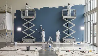 Commercial painting crew in Champaign, IL applying durable coatings to a business exterior